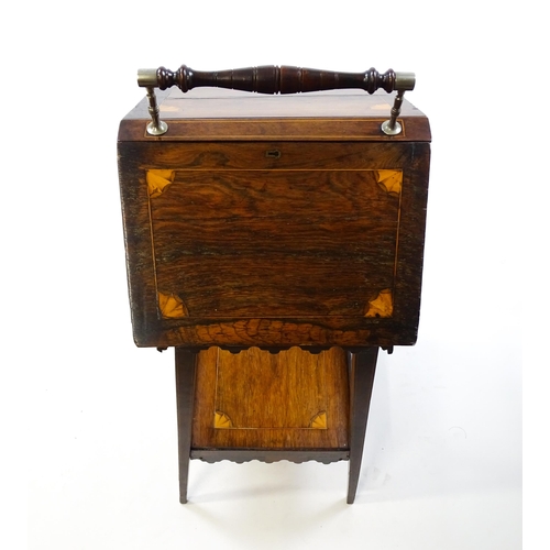 1755 - A 19thC rosewood sewing table with a carrying handle above two hinged lids with satinwood marquetry ... 