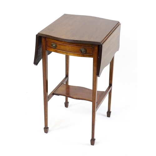 1757 - An early 20thC mahogany occasional table with two drop leaves flanking a single frieze drawer raised... 