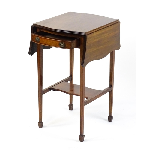 1757 - An early 20thC mahogany occasional table with two drop leaves flanking a single frieze drawer raised... 