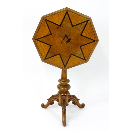 1759 - A 19thC occasional table with an octagonal satinwood tilt top, the top having an inlaid eight pointe... 