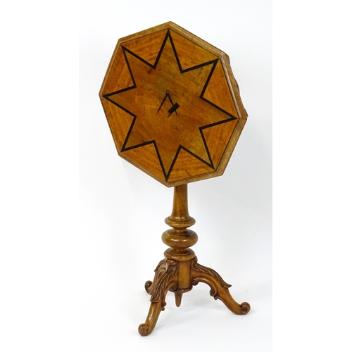 1759 - A 19thC occasional table with an octagonal satinwood tilt top, the top having an inlaid eight pointe... 