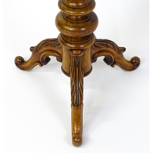 1759 - A 19thC occasional table with an octagonal satinwood tilt top, the top having an inlaid eight pointe... 