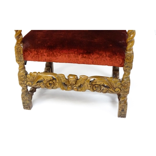 1793 - A 19thC Carloean style armchair with a carved cresting rail above barley twist supports and a caned ... 