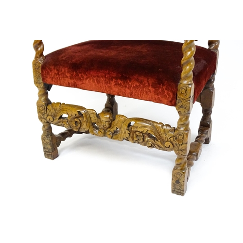 1793 - A 19thC Carloean style armchair with a carved cresting rail above barley twist supports and a caned ... 