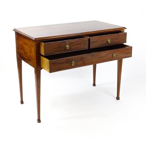 1799 - A late 19thC mahogany sideboard with two short drawers above a single long drawer with ring pull han... 