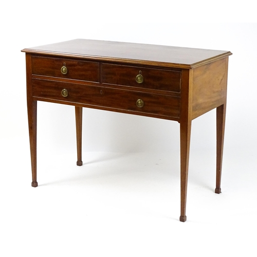 1799 - A late 19thC mahogany sideboard with two short drawers above a single long drawer with ring pull han... 