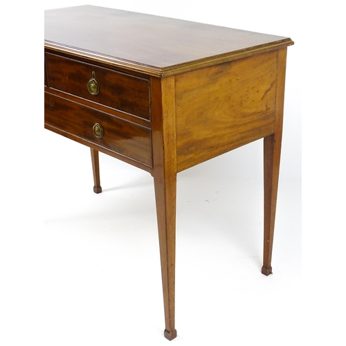 1799 - A late 19thC mahogany sideboard with two short drawers above a single long drawer with ring pull han... 