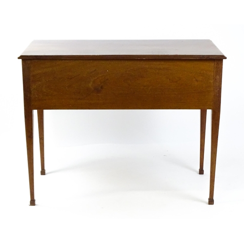 1799 - A late 19thC mahogany sideboard with two short drawers above a single long drawer with ring pull han... 