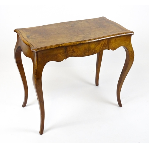 1800 - A late 19thC Louis XV style walnut side table with a shaped, moulded top above a single frieze drawe... 