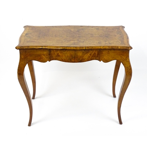 1800 - A late 19thC Louis XV style walnut side table with a shaped, moulded top above a single frieze drawe... 