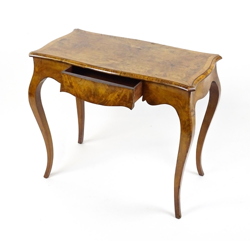 1800 - A late 19thC Louis XV style walnut side table with a shaped, moulded top above a single frieze drawe... 