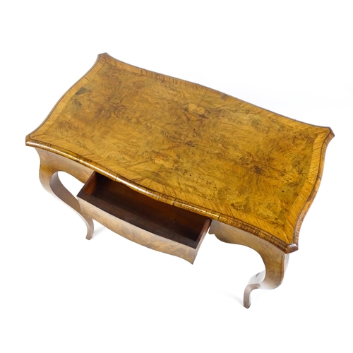 1800 - A late 19thC Louis XV style walnut side table with a shaped, moulded top above a single frieze drawe... 