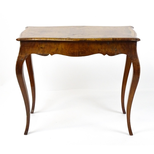 1800 - A late 19thC Louis XV style walnut side table with a shaped, moulded top above a single frieze drawe... 