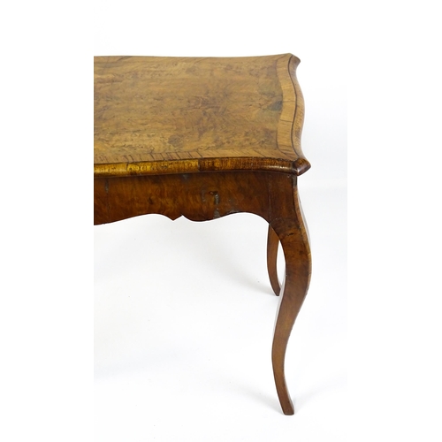 1800 - A late 19thC Louis XV style walnut side table with a shaped, moulded top above a single frieze drawe... 