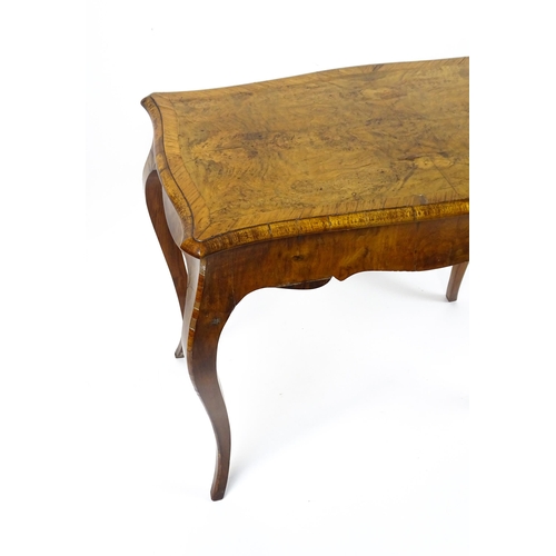 1800 - A late 19thC Louis XV style walnut side table with a shaped, moulded top above a single frieze drawe... 