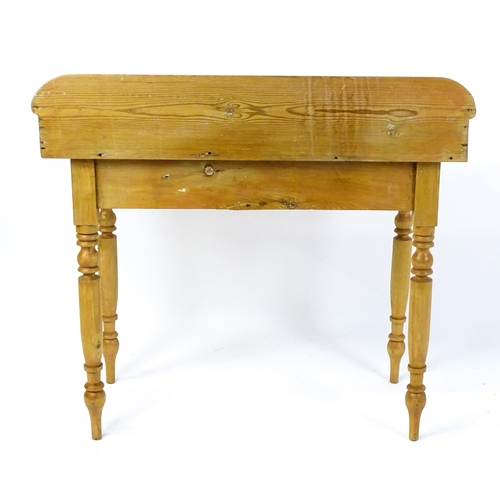 1801 - A Victorian pine washstand with a raised upstand above two short frieze drawers raised on four turne... 