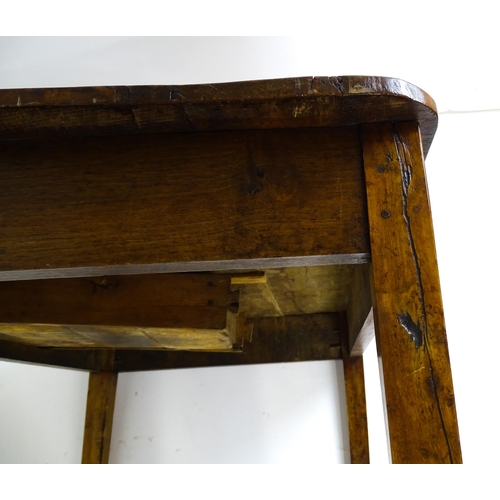 1805 - A 19thC fruitwood coffee table with a single frieze drawer, a peg jointed frame and raised on four t... 