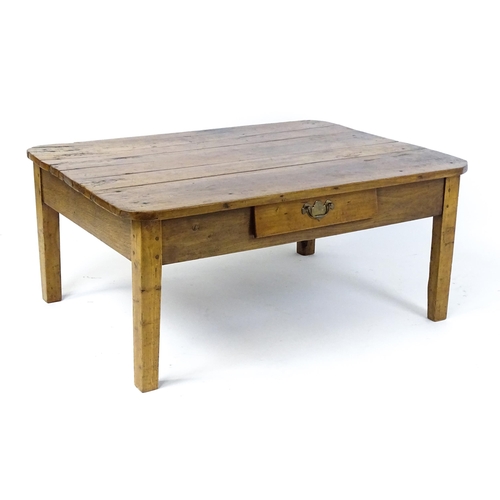 1805 - A 19thC fruitwood coffee table with a single frieze drawer, a peg jointed frame and raised on four t... 