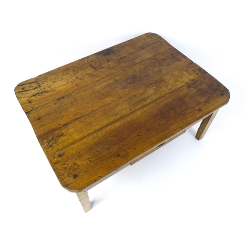 1805 - A 19thC fruitwood coffee table with a single frieze drawer, a peg jointed frame and raised on four t... 