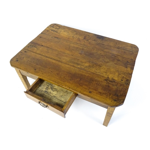 1805 - A 19thC fruitwood coffee table with a single frieze drawer, a peg jointed frame and raised on four t... 