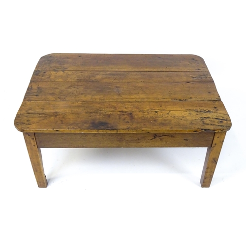 1805 - A 19thC fruitwood coffee table with a single frieze drawer, a peg jointed frame and raised on four t... 