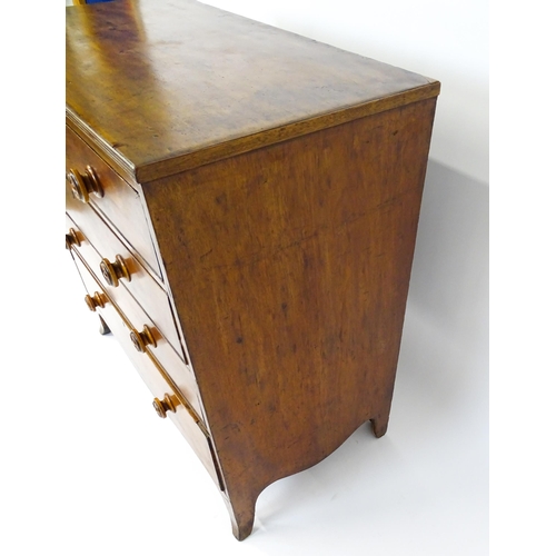 1806 - An early / mid 19thC mahogany chest of drawers with a reeded top above four long drawers with turned... 