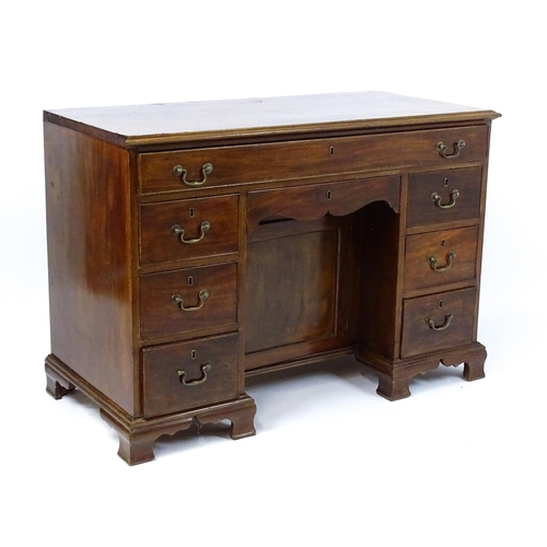 1807 - A Georgian mahogany double pedestal writing desk with a moulded top above a single long drawer above... 