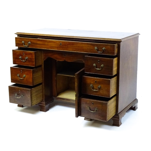 1807 - A Georgian mahogany double pedestal writing desk with a moulded top above a single long drawer above... 