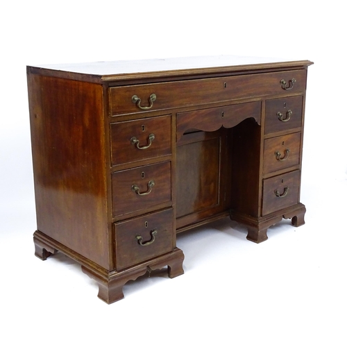 1807 - A Georgian mahogany double pedestal writing desk with a moulded top above a single long drawer above... 