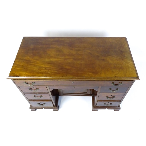 1807 - A Georgian mahogany double pedestal writing desk with a moulded top above a single long drawer above... 