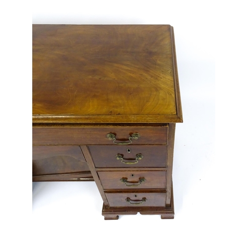 1807 - A Georgian mahogany double pedestal writing desk with a moulded top above a single long drawer above... 