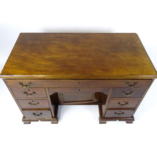 1807 - A Georgian mahogany double pedestal writing desk with a moulded top above a single long drawer above... 