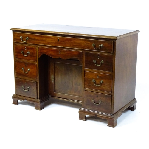 1807 - A Georgian mahogany double pedestal writing desk with a moulded top above a single long drawer above... 