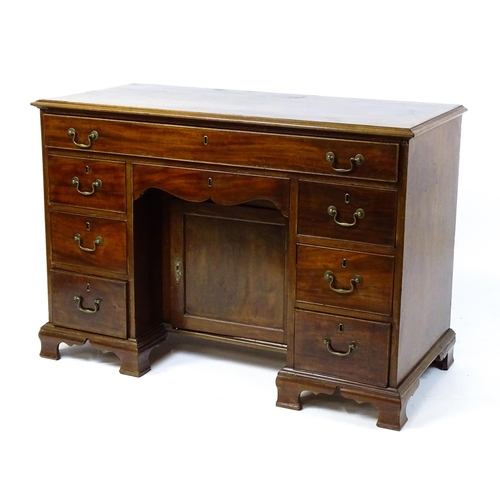 1807 - A Georgian mahogany double pedestal writing desk with a moulded top above a single long drawer above... 