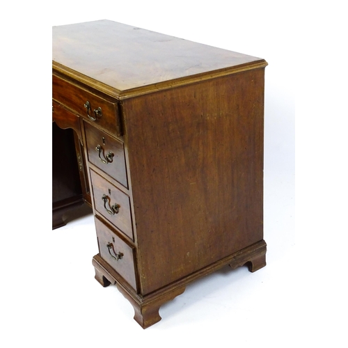 1807 - A Georgian mahogany double pedestal writing desk with a moulded top above a single long drawer above... 