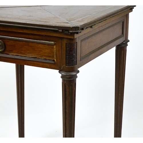 1809 - A 19thC mahogany envelope card table with two frieze drawers raised on four turned tapering and reed... 