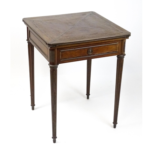 1809 - A 19thC mahogany envelope card table with two frieze drawers raised on four turned tapering and reed... 