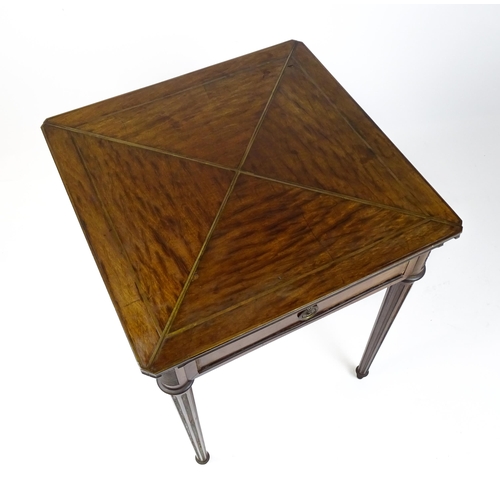 1809 - A 19thC mahogany envelope card table with two frieze drawers raised on four turned tapering and reed... 