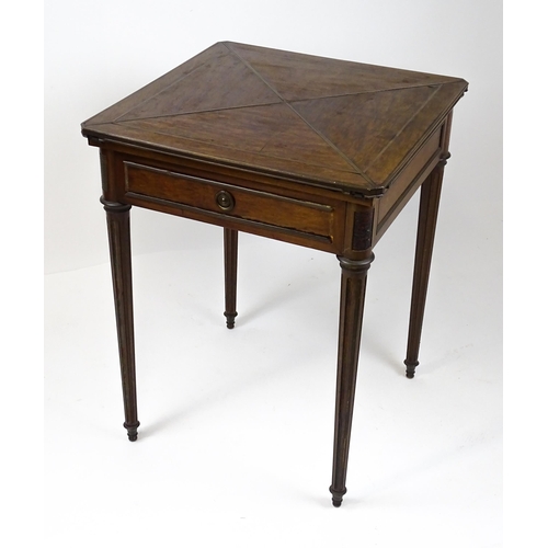 1809 - A 19thC mahogany envelope card table with two frieze drawers raised on four turned tapering and reed... 