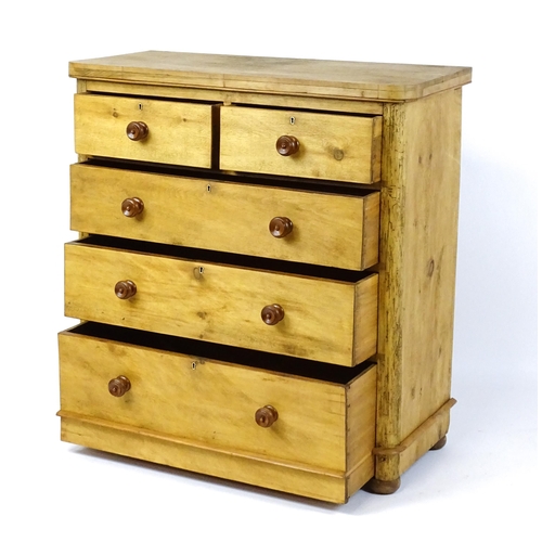 1811 - A late Victorian pine chest of drawers comprising two short over three long graduated drawers with t... 