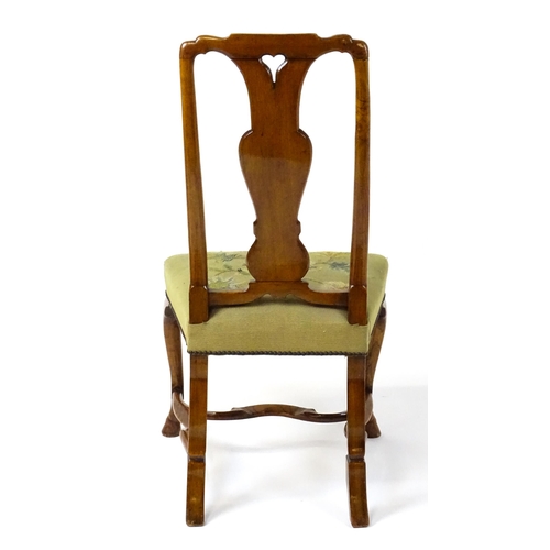 1812 - An early / mid 18thC Dutch side chair with a profusely inlaid walnut frame, the satinwood marquetry ... 