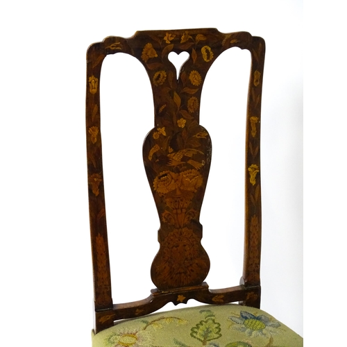 1812 - An early / mid 18thC Dutch side chair with a profusely inlaid walnut frame, the satinwood marquetry ... 