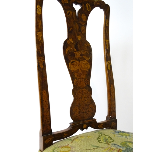 1812 - An early / mid 18thC Dutch side chair with a profusely inlaid walnut frame, the satinwood marquetry ... 