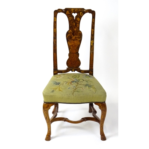 1812 - An early / mid 18thC Dutch side chair with a profusely inlaid walnut frame, the satinwood marquetry ... 