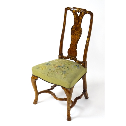 1812 - An early / mid 18thC Dutch side chair with a profusely inlaid walnut frame, the satinwood marquetry ... 