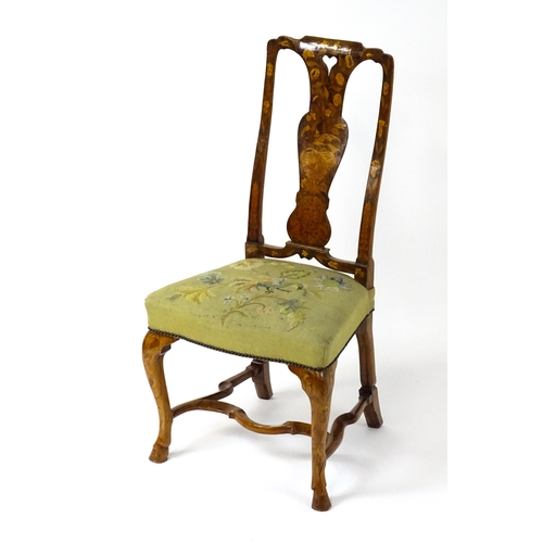 1812 - An early / mid 18thC Dutch side chair with a profusely inlaid walnut frame, the satinwood marquetry ... 