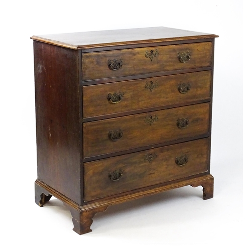 1813 - A Georgian mahogany chest of drawers comprising four long drawers with swan neck handles and pierced... 