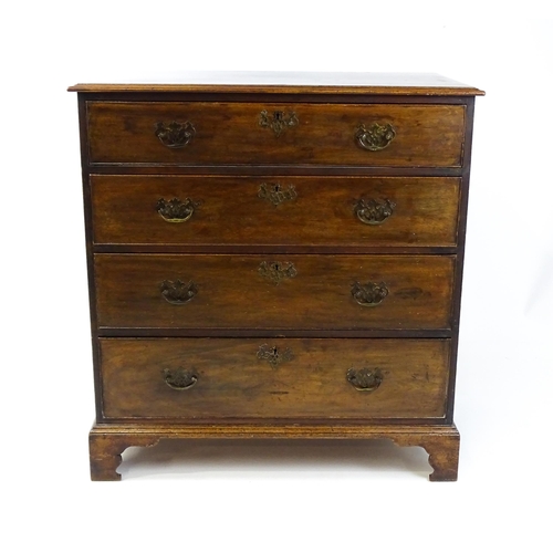 1813 - A Georgian mahogany chest of drawers comprising four long drawers with swan neck handles and pierced... 