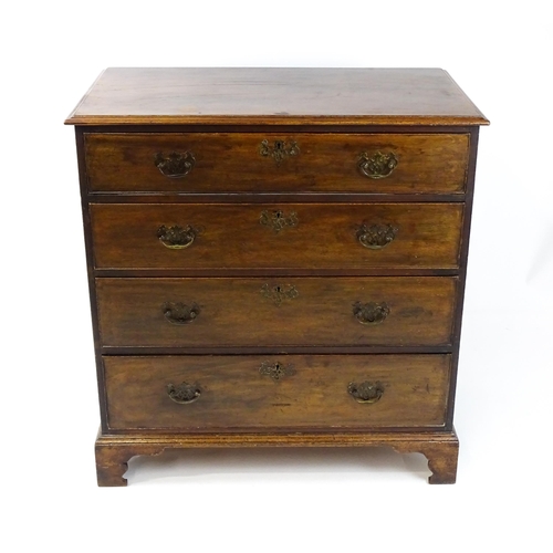 1813 - A Georgian mahogany chest of drawers comprising four long drawers with swan neck handles and pierced... 