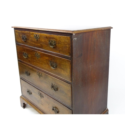 1813 - A Georgian mahogany chest of drawers comprising four long drawers with swan neck handles and pierced... 